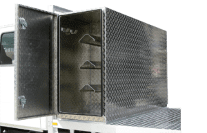 7- Checkerplate headboard mounted toolbox with internal 'racking' and hooks. With Swing open doors and whale tail locks.