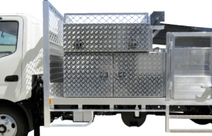 13- Alloy Checkerplate toolbox with two swing open doors and one lift up door.